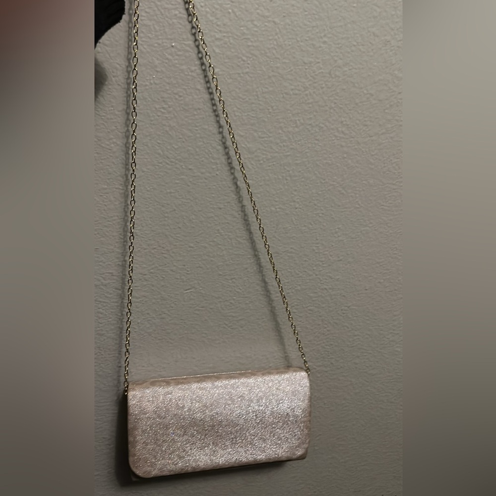 D’margeaux gold shimmery purse with a faint cheetah print design.